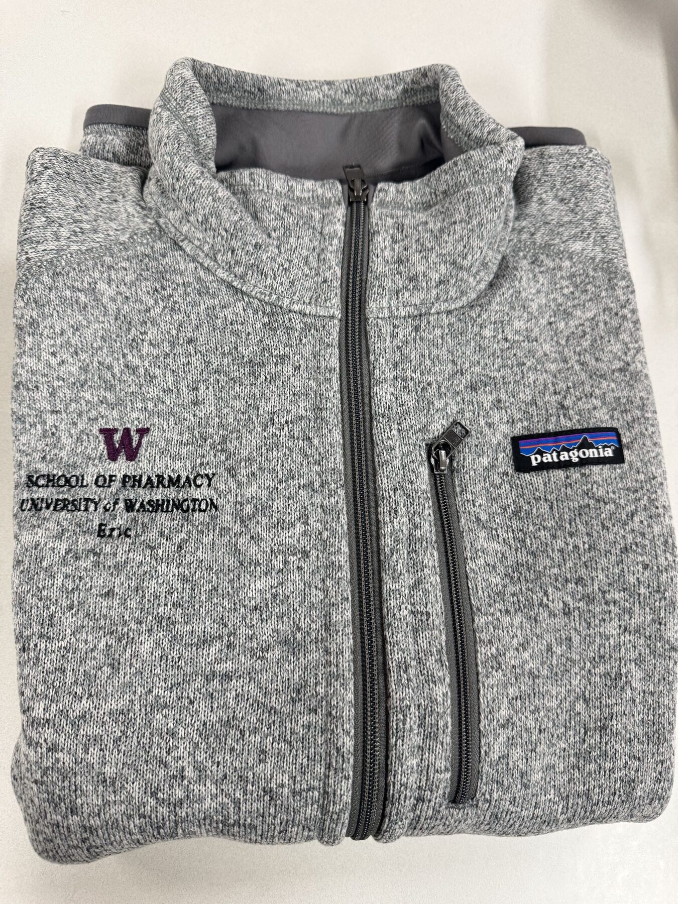 Gray quarter-zip embroidered with UW School of Pharmacy logo