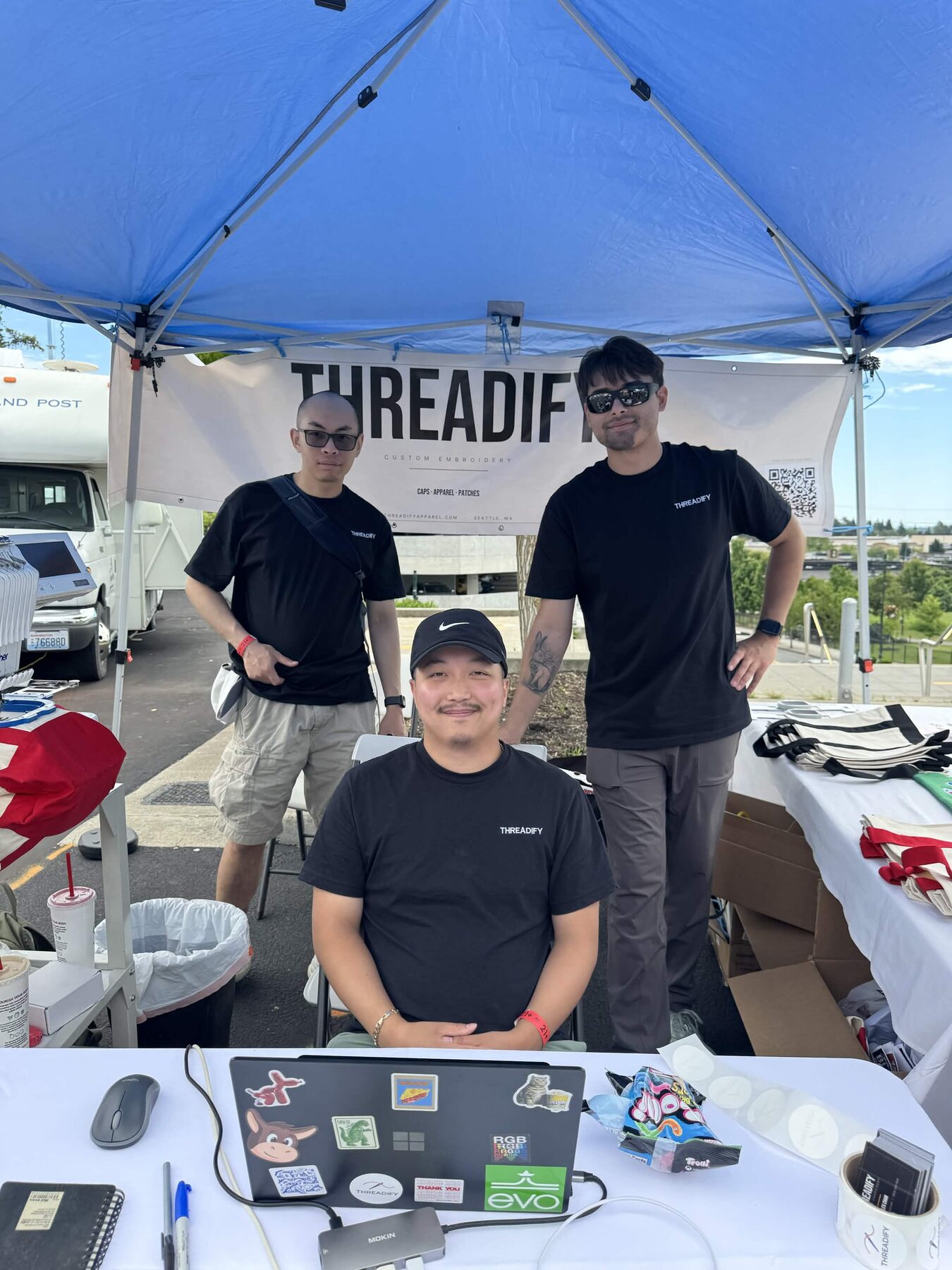 Justin Kaiponen, Alex Chan and the Threadify crew at their booth in Federal Way, WA
